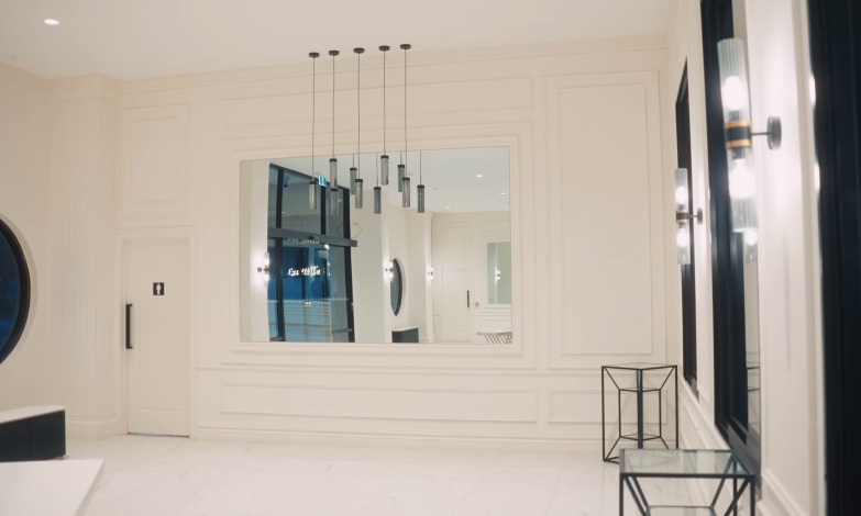 Commercial foyer renovation — pendant lights and mirror feature